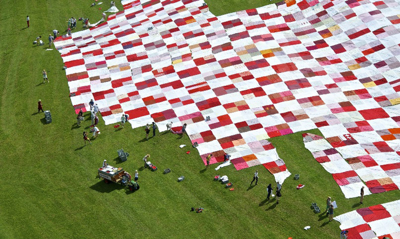 Illustration for article titled The World's Biggest Picnic Blanket Is Growing in the Swiss Countryside